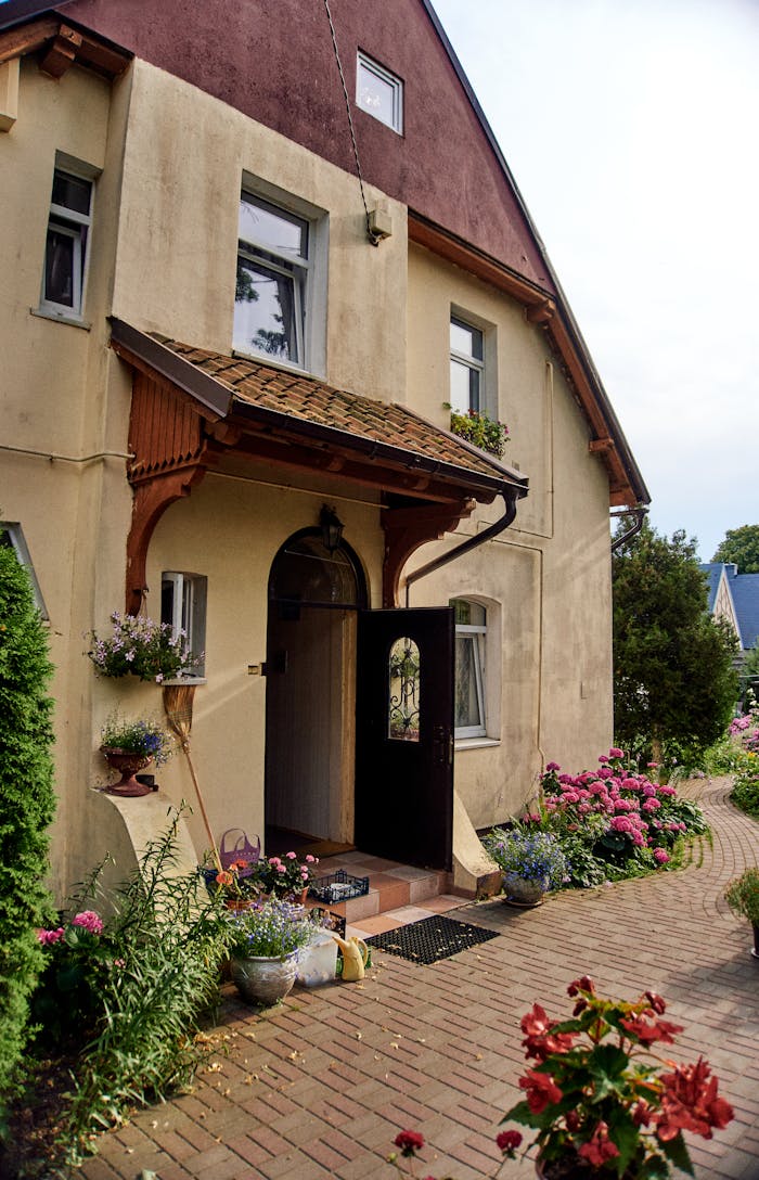 A house with flowers and plants in front of it